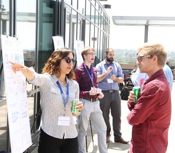 Research Showcase: graduate students present their projects to attendees.