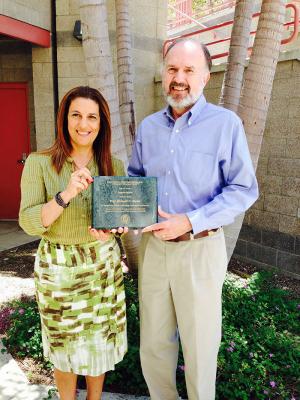 Founding Director Richard N. Taylor receives Award of Appreciation from Interim Director Cristina V. Lopes.