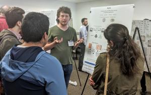 Ph.D. student Ismet Burak Kadron, UCSB, presents his research poster to SuCSES attendees.